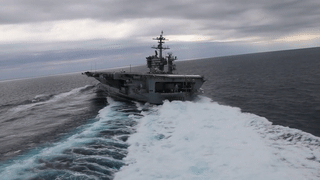 Nimitz-class aircraft carrier USS Abraham Lincoln (CVN 72) performs high-speed turns in the Atlantic Ocean